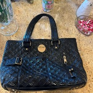Marc Jacobs black quilted leather hobo satchel with gold hardware.